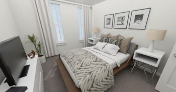 a bedroom with a bed that has a zebra blanket on top of it